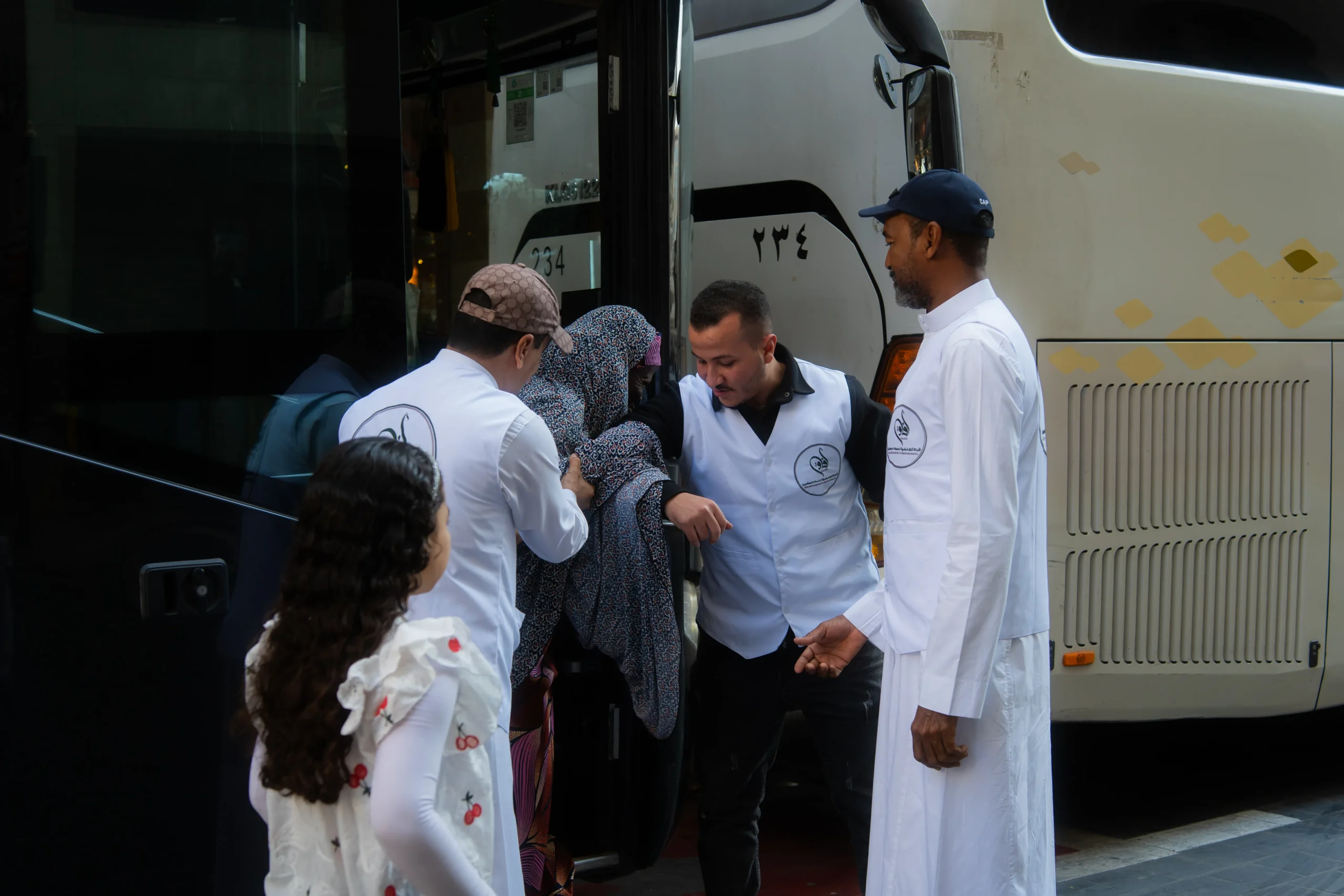 Stunning upward view of the iconic Makkah Clock Tower against a cloudy sky, symbolizing spiritual significance.